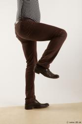 Leg flexing reference of body black white striped shirt brown jeans brown shoes Arturo